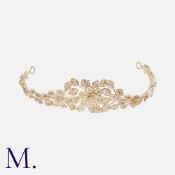 A Silver Tiara of floral design featuring filigree wirework leaves, centring on a central flower