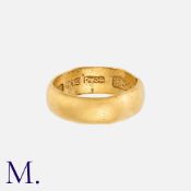 A Yellow Gold Band in high carat gold with Chinese markings inside the band. Band unmarked but tests