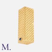 CARTIER, A Lipstick Case in 18k yellow gold, of woven mesh design, with a cabochon sapphire.