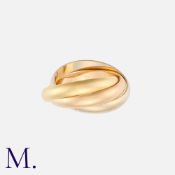 CARTIER. Trinity Rings in 18K yellow, white and rose gold. Each band is approximately 3.5mm wide.