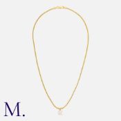 A Diamond Solitaire Pendant And Chain in 14k yellow gold, set with a principal round cut diamond