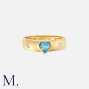 An Aquamarine and Diamond Ring in 18K yellow gold, set with a heart-cut aquamarine and flush set