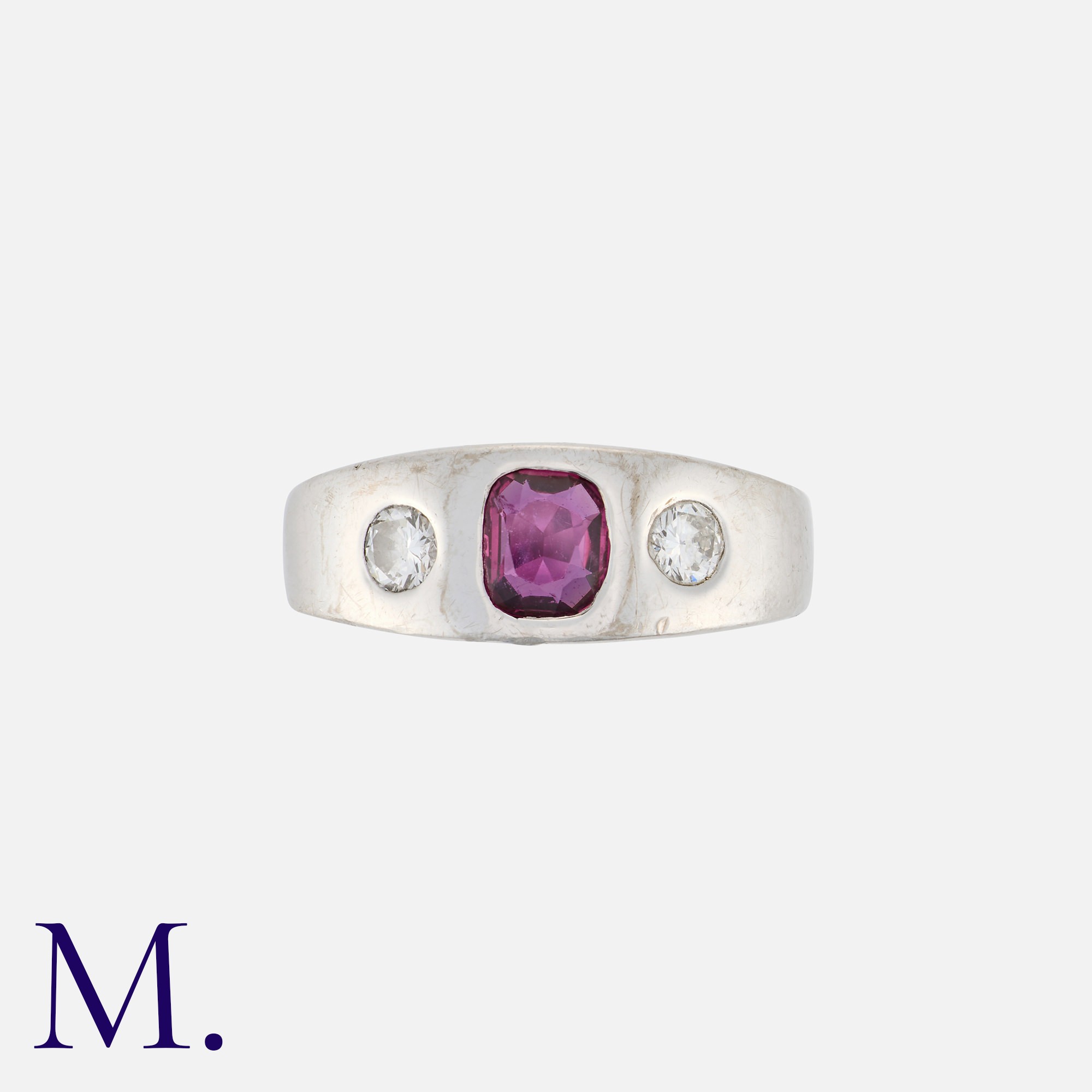 A Ruby and Diamond Gypsy Ring in 14K white gold, set with a cushion cut ruby to the centre with