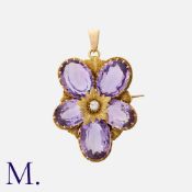 A Large Antique Amethyst and Diamond Pendant Brooch in yellow gold, of floral design, set
