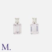 A Pair of Kunzite and Diamond Earrings in 18K white gold, each set with an emerald cut kunzite