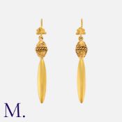 An Antique Pair Of Drop Earrings in 18k yellow gold, each comprising a scrolling top suspending a