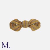 A Woven Bow Brooch created from fine 15K yellow and rose gold and platinum, with gold brooch fitting