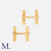 MELLERIO. A Pair of Cufflinks in 18ct yellow gold with ribbed geometric batons. Signed Mellerio
