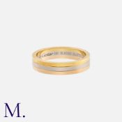 CARTIER. A 3-Colour Band in 18K yellow, white and rose gold. Signed Cartier and serial numbered.