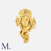 An Art Nouveau Ring in yellow gold, depicting the face of a woman with floral motifs set with