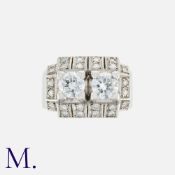 A French Diamond Ring in 18k white gold, set with two principal transitional cut diamonds each