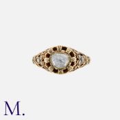An Antique Rose Cut Diamond Ring in yellow gold, the ornate body set with a principal rose cut of