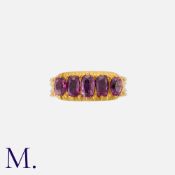 An Antique Ruby Five Stone Ring in yellow gold, set with a row of elongated oval cut rubies.