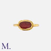 A 17th Century Arabic Seal Ring set with a carnelian inscribed with Arabic script for 'Allah