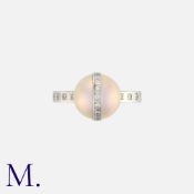 DAVID ASHTON. A Pearl and Diamond Set Ring in platinum, set with a Tahitian Pearl with diamond