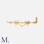 A Set of Gold Brooches, one a walking stick in 9ct yellow gold, one a riding crop and horse bits