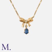 A Sapphire and Diamond Bow Pendant Necklace in 9k yellow gold, the bow motif set with a round cut