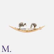 A Diamond Bird Brooch in yellow gold and silver comprising two rose cut diamond set birds with