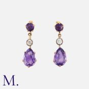 A Pair of Amethyst and Diamond Earrings in 9ct yellow gold, set with pear-cut amethyst drops and