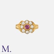 A Georgian Ruby and Pearl Ring in 15K yellow gold, set with a round cut ruby to the centre, with