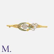 An Art Nouveau Diamond & Enamel Brooch in 18ct yellow gold, set with a larger rose cut diamond to