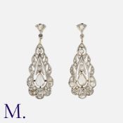 A Pair Of Rose Cut Diamond Earrings in 18k yellow gold and platinum, each set with a principal