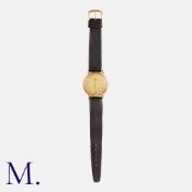 OMEGA, A Vintage Gents Wristwatch in 9k yellow gold, the patina dial with Arabic numeral hour