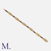 An Art Nouveau Onyx and Pearl Bracelet in 18K yellow gold, set with six calibrated onyx stones and