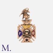 A Masonic Pendant in rose gold, in a Maltese cross design with crossed halberds, knight's helm to