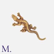 An Antique Lizard Brooch in 15k yellow gold, designed as a lizard, with detailed engraved decoration