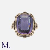 A Blue Stone Ring in yellow gold and silver, the large blue gemstone set in a floral decorative