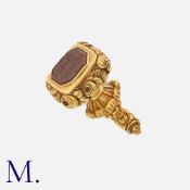 An Antique Georgian Seal in yellow gold, set with a carved carnelian intaglio reading ' I. Evcpuo