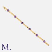 BOUCHERON. An Amethyst Bracelet in 18K yellow gold, set with amethyst beads at intervals. Signed