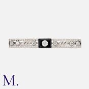 A Fine Art Deco Onyx & Diamond Brooch in 18K white gold and platinum, set with old cut and single