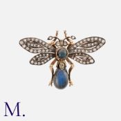 An Antique Labradorite & Diamond Insect Brooch in 18K gold and silver, set with a pear-shaped