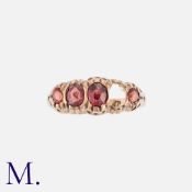 An Antique Ruby Ring in 9K yellow gold, set with oval cut rubies (one deficient). Hallmarked.