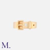 An Antique Buckle Ring in 18k yellow gold, designed as a belt, set with a round cut diamond.