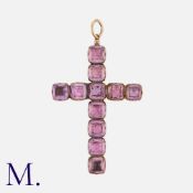 An Antique Amethyst Crucifix pendant in yellow gold, comprising eleven square cushion cut