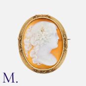An Antique Cameo Brooch in 18K yellow gold, set with a carved shall cameo with a female design.