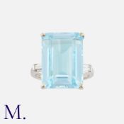 A Topaz And Diamond Ring in 18k white gold, set principally with an octagonal cut blue topaz of