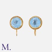 A Pair of Topaz Earrings in 14K yellow gold, each earring set with a deep blue round cut topaz.