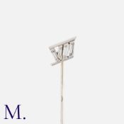 VAN CLEEF & ARPELS. A Diamond Pin in 18k white gold and platinum in the design of a Roman numeral