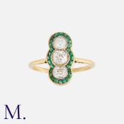 An Emerald and Diamond Ring in 18K yellow gold, set with three old cut diamonds weighing approx. 1.