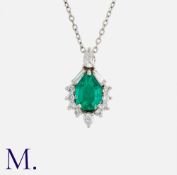 An Emerald and Diamond Pendant Necklace in 18K white gold, set with a pear-cut emerald (