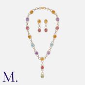 A Gemstone and Diamond Collar and Earrings Set in 18K yellow and white gold, set with oval-cut