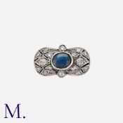 NO RESERVE. A Sapphire and Diamond Ring set in the centre of a plaque with an oval cut sapphire