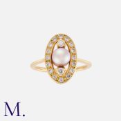A Pearl And Diamond Ring in yellow gold, set centrally with a round pearl of approximately 5.8mm