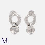 A Pair Of Diamond Drop Earrings in 18k white gold, of hoop design, suspending an articulated drop.