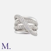 A Diamond Dress Ring in 18k white gold, comprising five bands, of crossover design, three of which