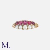 An Antique Ruby, Pearl And Diamond Ring in yellow gold, set with one row of graduated round cut